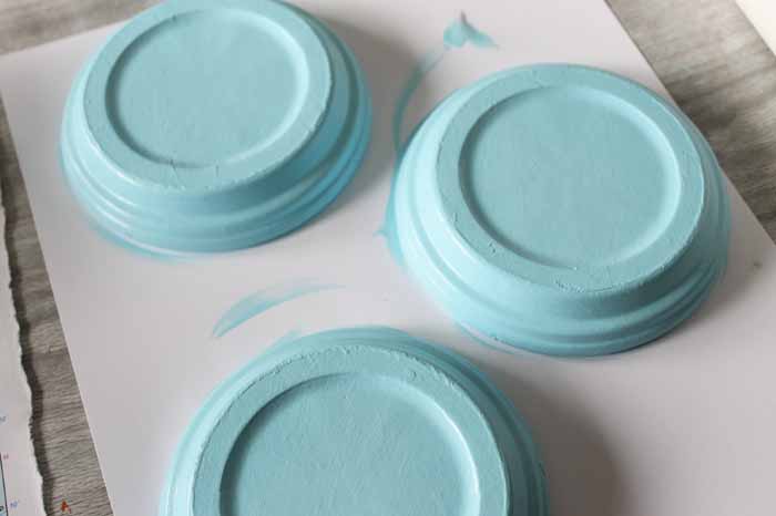 Painting terra cotta saucers to make coasters.