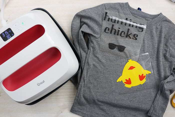 Adding Cricut iron on glitter vinyl to a shirt using the Cricut Easy Press