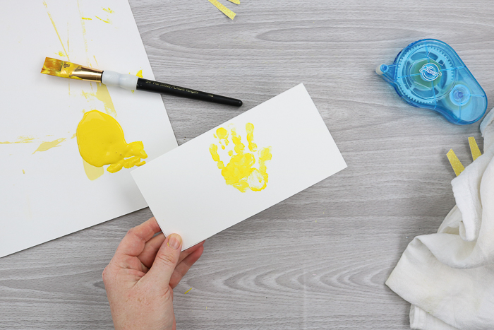 Adding a painted handprint to the front of the card