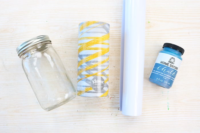 Supplies to make a mason jar tissue holder including a wide mouth mason jar and upright tissues.
