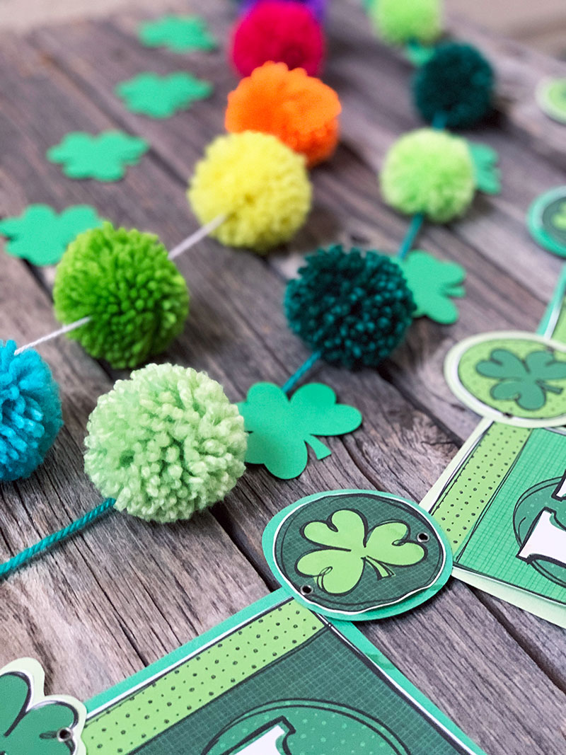 Make some Saint Patrick's Day decor with this DIY pom pom garland tutorial!