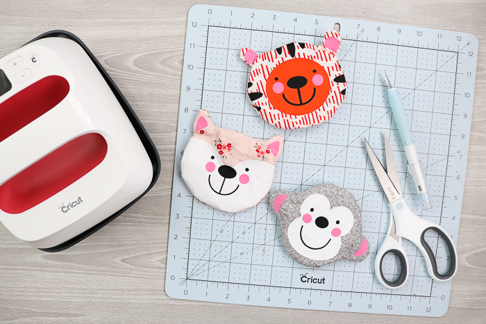 Animal faced zipper pouches with a fox, monkey, and tiger shape. All Cricut projects you can make with the Cricut Maker.