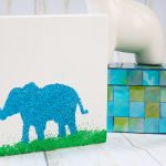 The best glue for glitter is Mod Podge Ultra. Here we are using it to create some glitter art with an elephant!