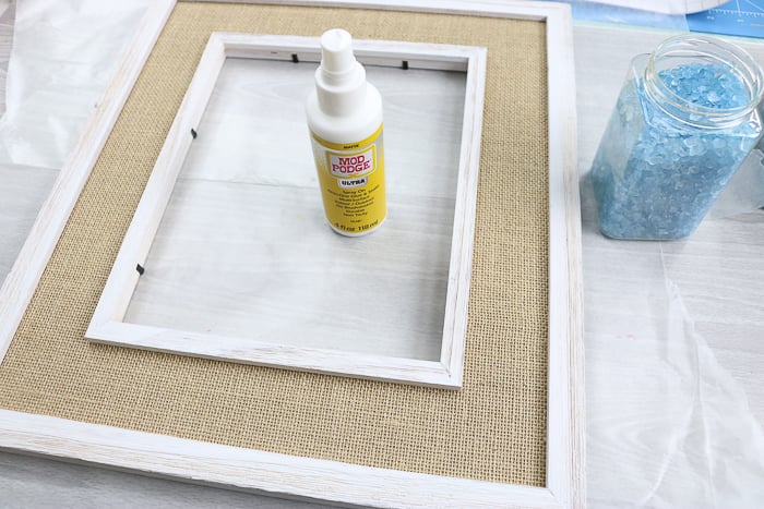 Using Mod Podge Ultra to adhere glass to a surface.