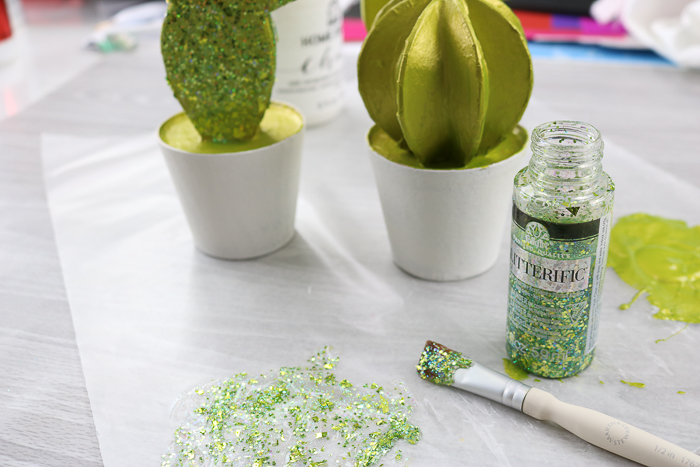 Adding Glitterific paint to a paper mache cacti