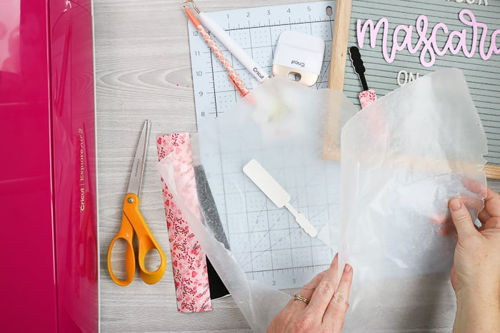 Allowing Mod Podge pieces to dry between sheets of wax paper