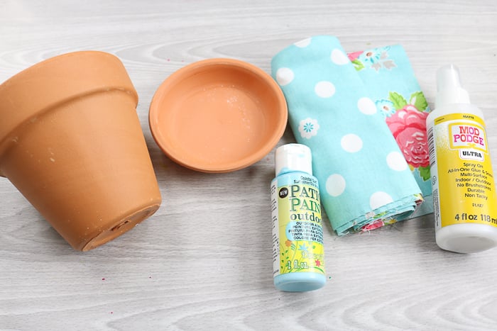 Supplies needed to make fabric covered planters with mod podge