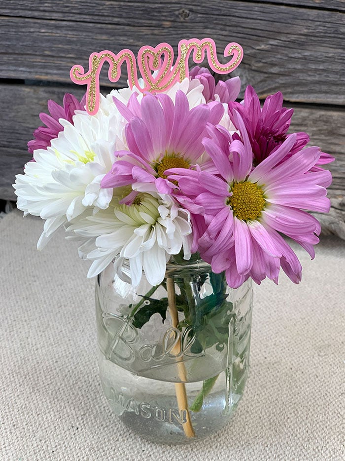 A vase filled with purple flowers