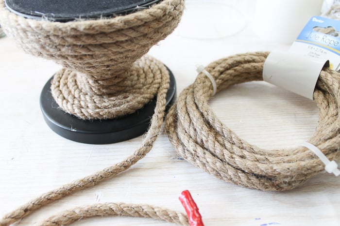 This rustic rope will add a nautical touch to just about any object, like this large glass candle holder