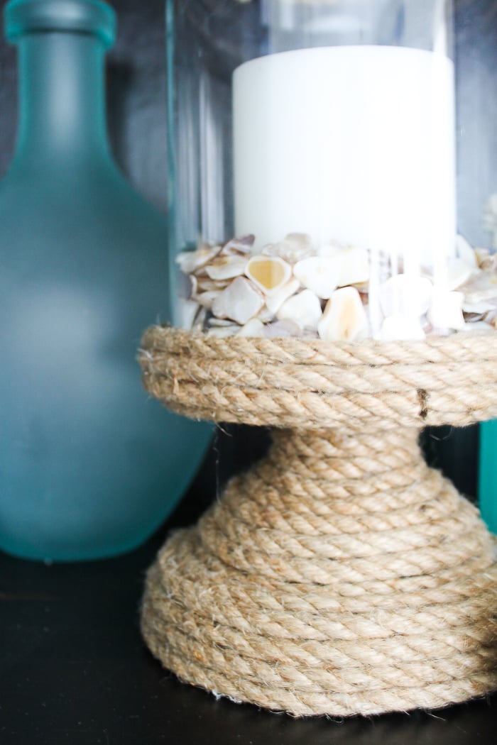 This nautical themed candle holder is an easy DIY you can make with some rope