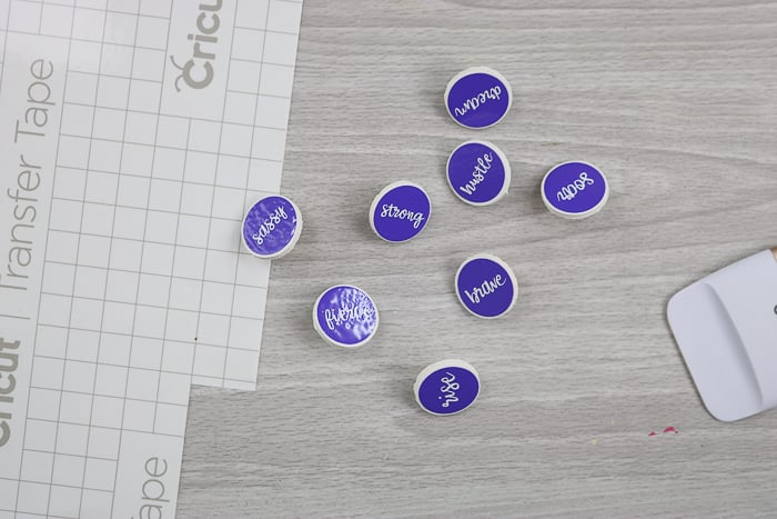 Custom thumbtacks to put on a DIY cork board made with the Cricut machine.