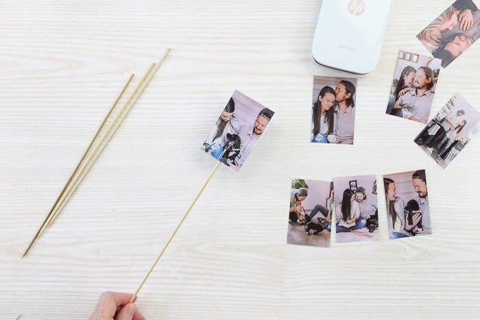 adding printed photos to wood skewers