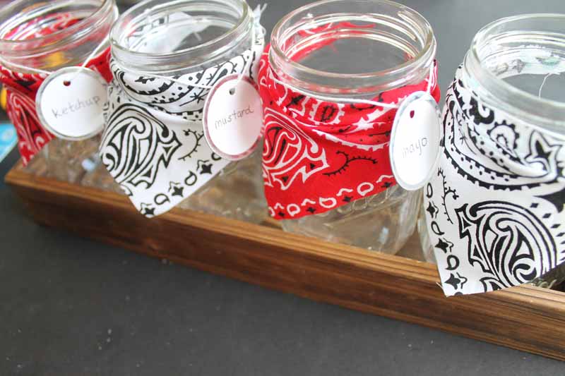 Adding mason jars to a wood box for a bbq party buffet