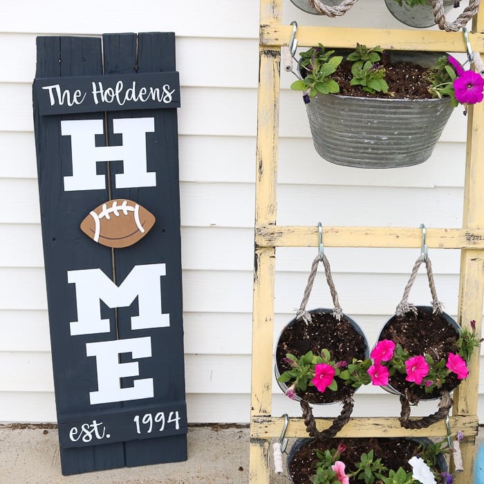 home wreath sign with a football as the O