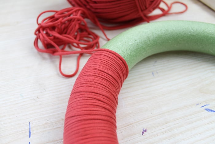 wrapping yarn around a wreath form