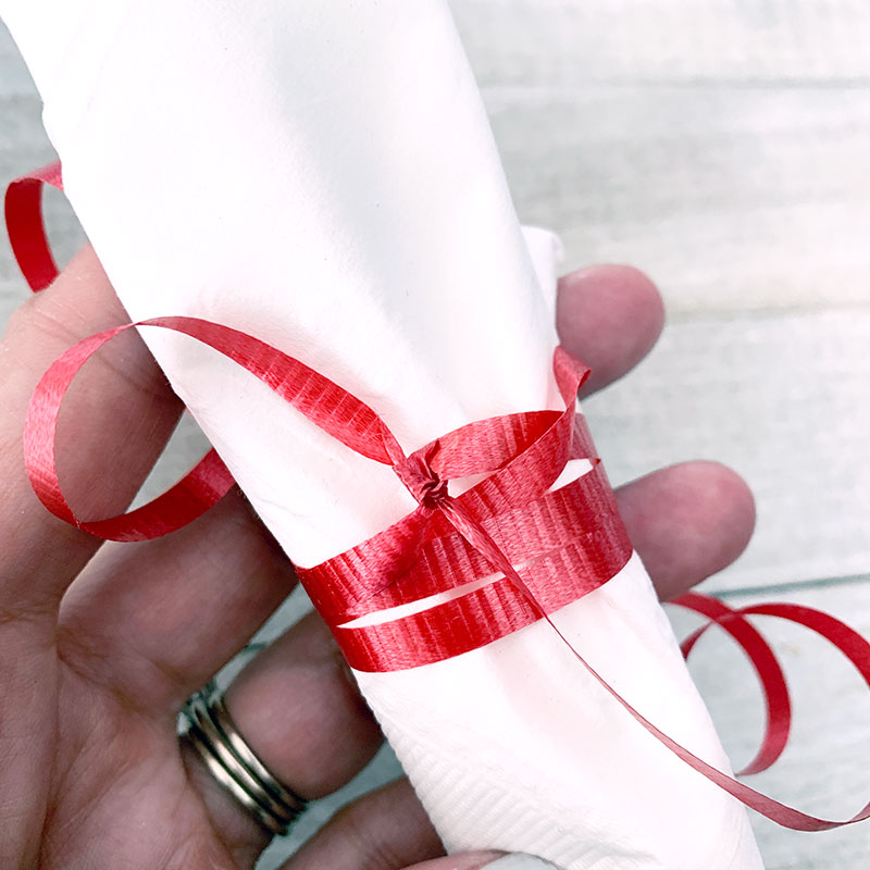 curling ribbon as a napkin ring