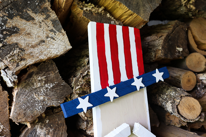 americana hat on a wooden uncle sam