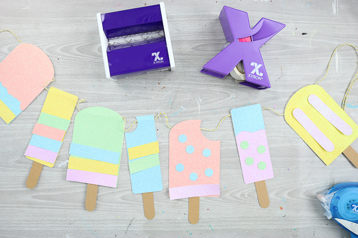 adding decorative elements to paper popsicles