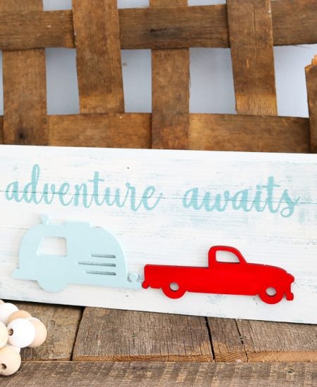 cute travel sign with a camper
