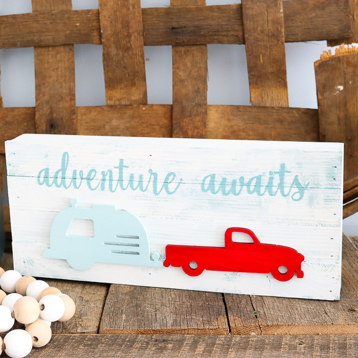 cute travel sign with a camper