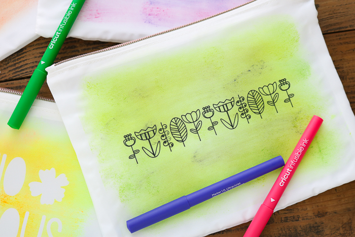 Green watercolor design on a DIY makeup bag