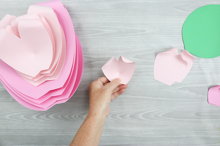 Now that you've created your flower petals using colorful construction paper, it's time to create the flowers