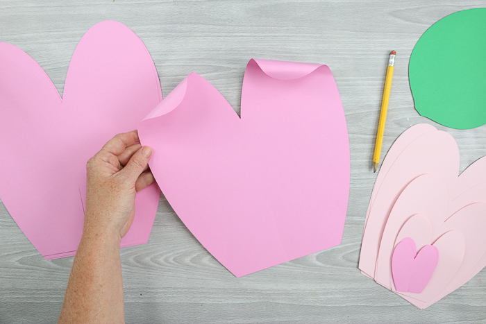 Curling the ends of your giant paper flowers makes them look much more like flower petals!