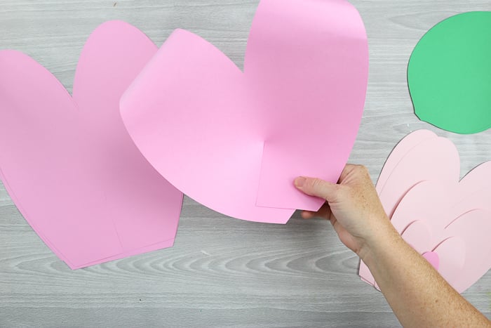 Glue the ends of your paper flower petals together to make a 2D petal shape