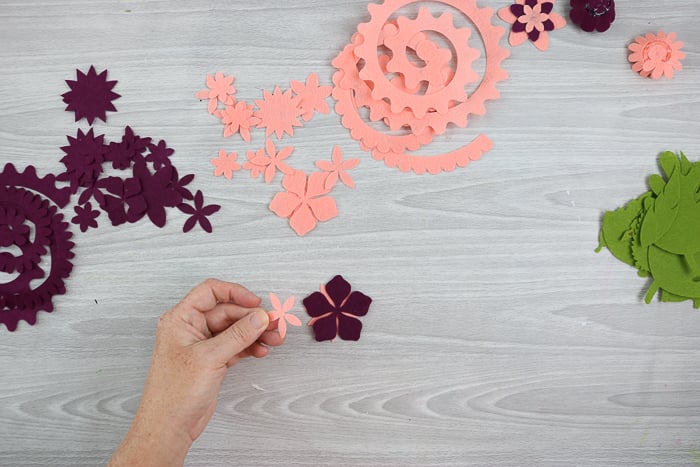 using hot glue to assemble Cricut flowers