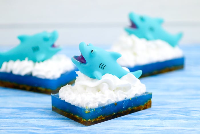 whipped soap on top of a blue bar with a shark