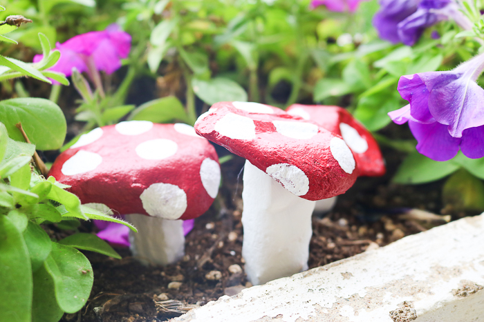 painted stones that look like mushrooms are perfect for your garden