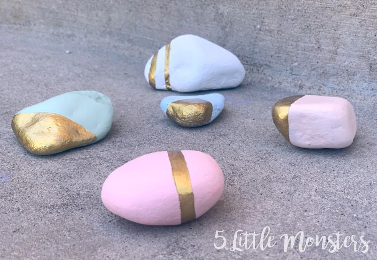 geometric gold and pastel painted rocks