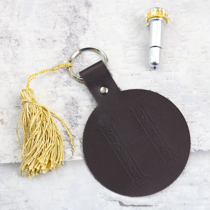 monogrammed keychain with gold tassle