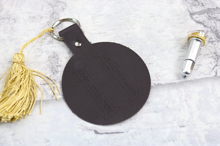 monogrammed keychain with gold tassle