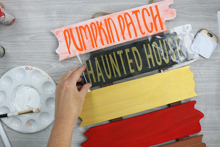 adding cricut vinyl to halloween wood sign