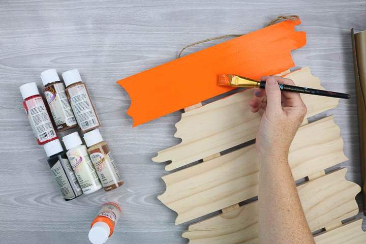 painting a sign for halloween