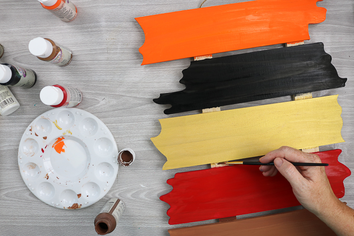 painting an outdoor halloween sign