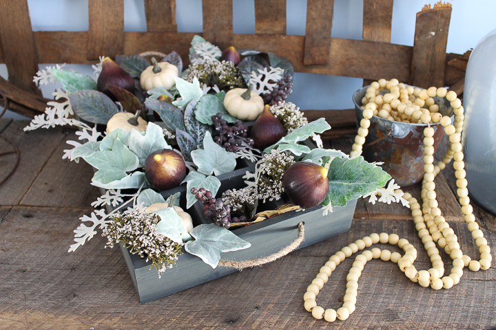 adding fall florals to wood crate