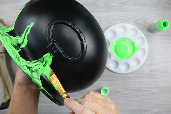 adding glow in the dark paint to a halloween candy bucket