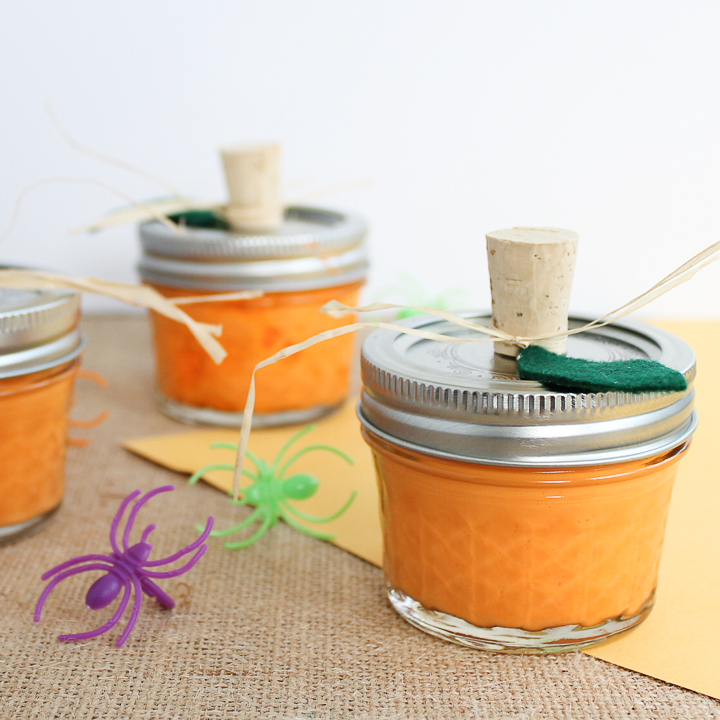 orange halloween slime in a mason jar