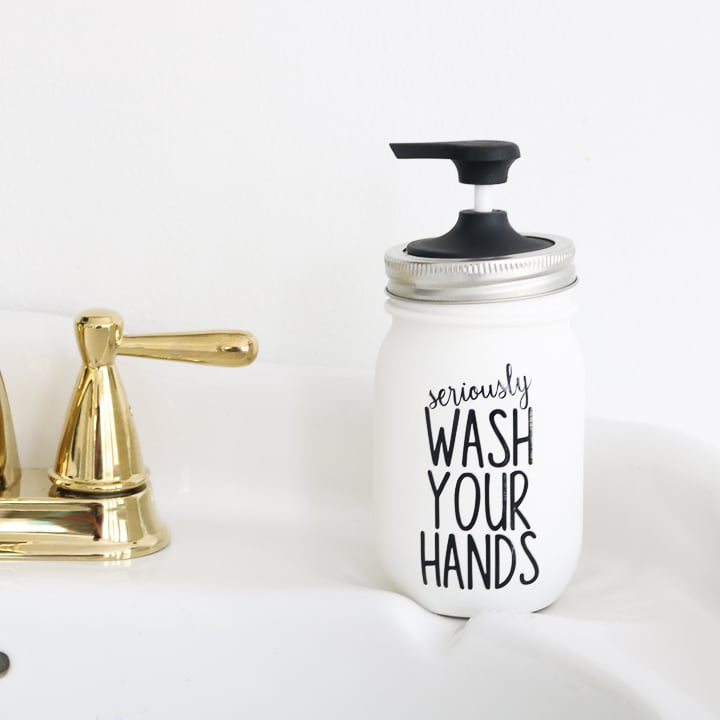 This Rae Dunn inspired mason jar soap dispenser is perfect for your bathroom!