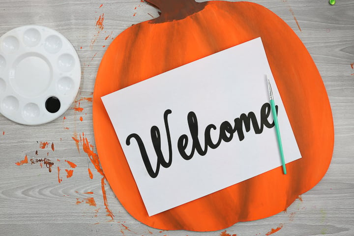 adding welcome lettering to pumpkin shape