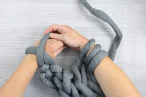 completing an arm knit craft idea