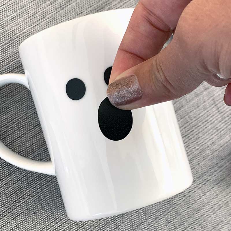 Decorate a mug with vinyl cut out stickers