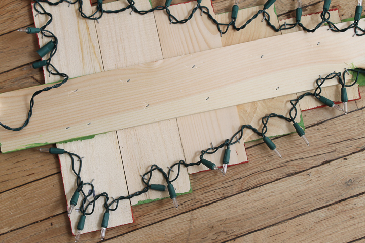 adding lights to a christmas sign