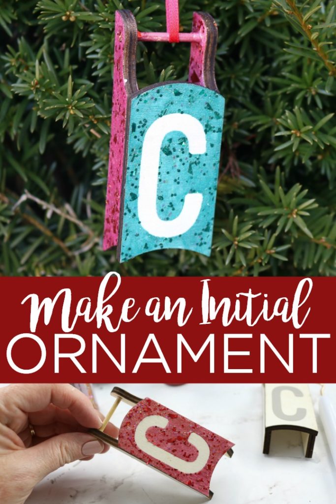 You can make an initial ornament with a small wood sled and some glitter paint! This fun project is perfect for kids and your Christmas tree! #christmas #christmasornament #christmastree #sled #glitter #glittercraft #craft #diy #wood #woodsled #holidays