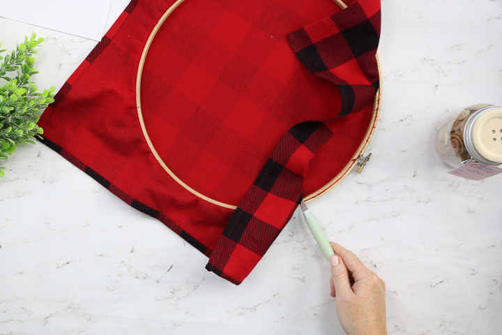 christmas plaid fabric in an embroidery hoop