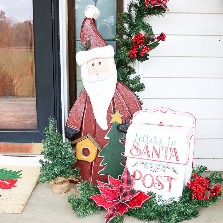 wood santa on front porch