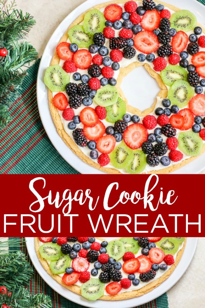 Make a sugar cookie fruit pizza in the shape of a wreath for the holiday season! This easy holiday dessert recipe will be the talk of the party! #christmas #holiday #dessert #yum #food #foodie #holidaydessert #christmasdessert #fruitdessert #fruit #sugarcookie #easyrecipe