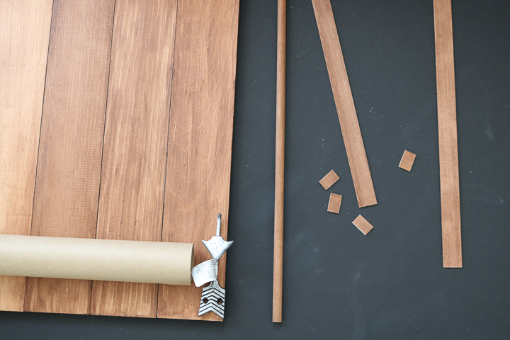 cutting wood to size for a kraft paper roll holder